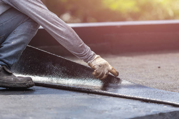 Professional Basement Waterproofing technician working in Farmersville Station, NY